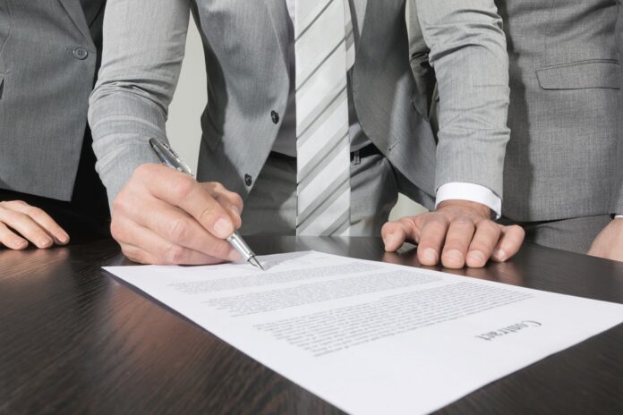 Business people sign contract